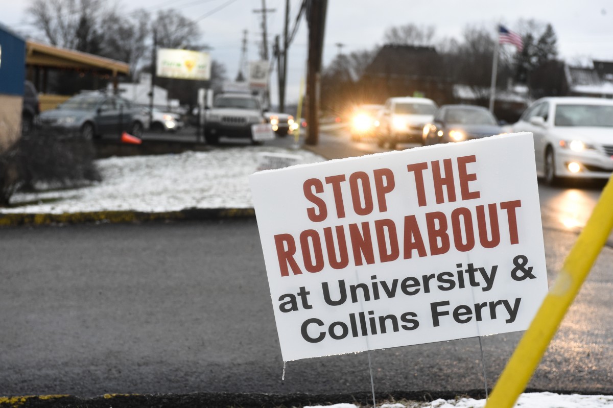 Citizens post signs opposing DOH roundabout plans
